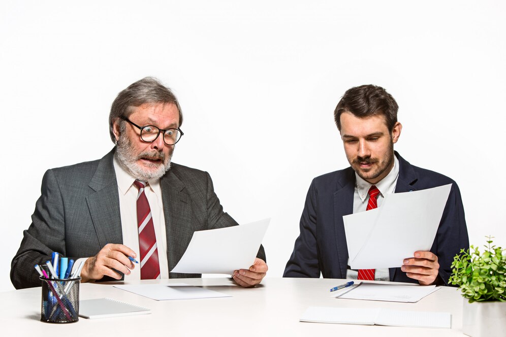 two colleagues working together office white studio