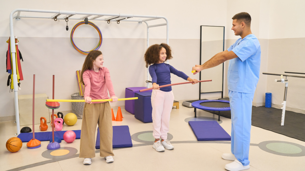 Pediatric guiding children during a therapy session.