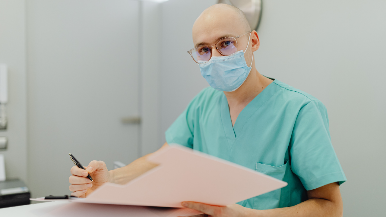 Anesthesiologists reviewing a medical malpractice policy document