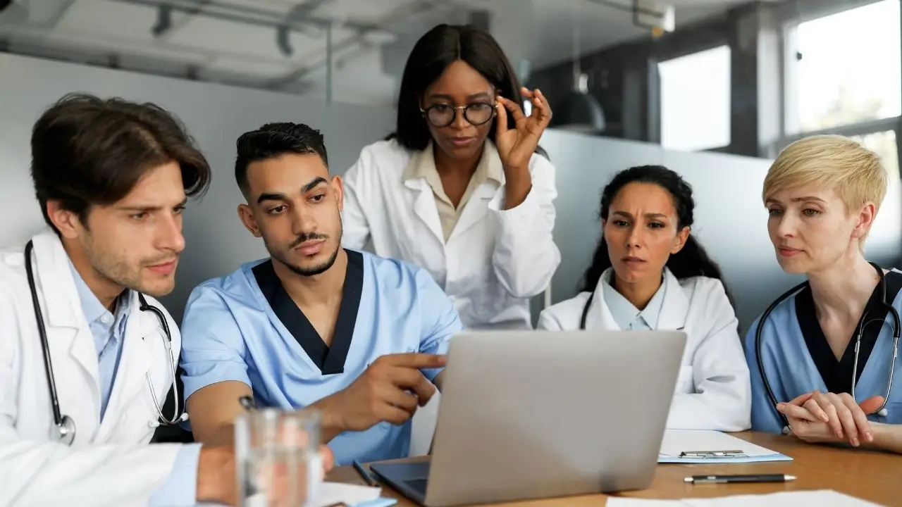 Healthcare team reviewing tail policy details