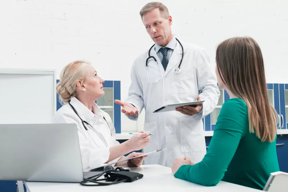 doctors discussing about tail coverage cost with patient
