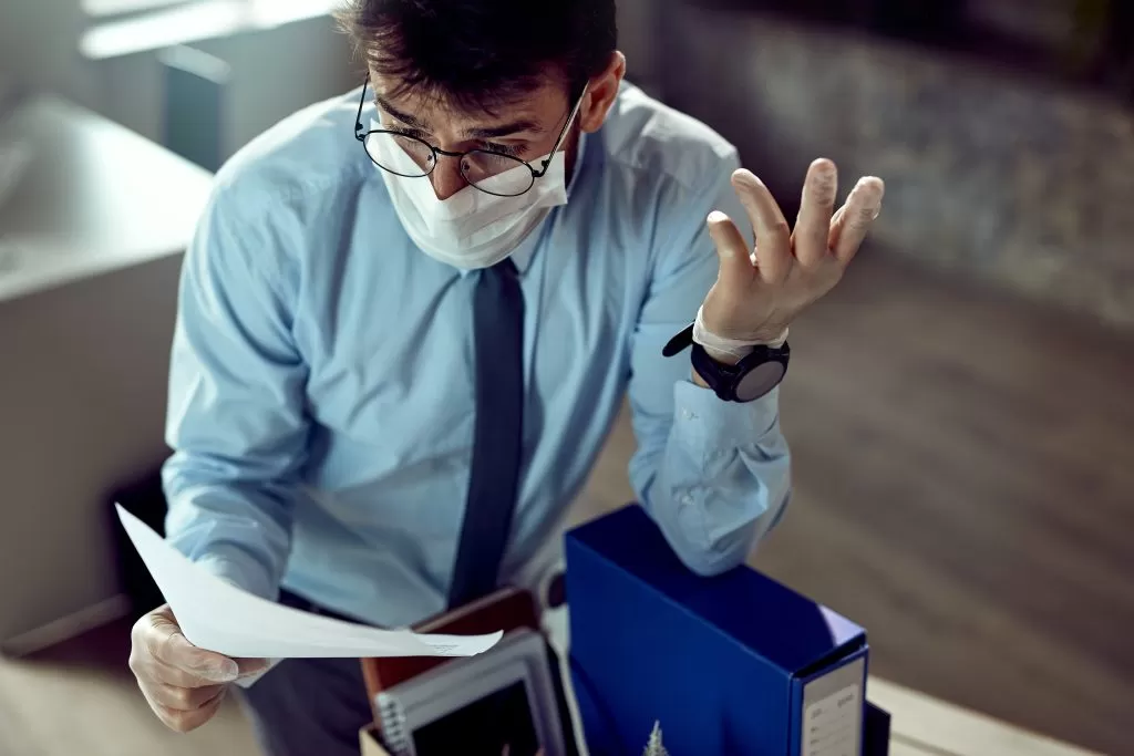 man reading malpractice insurance policy