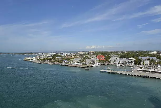 A vibrant Florida cityscape meets the ocean, highlighting the varied territories within the state 
