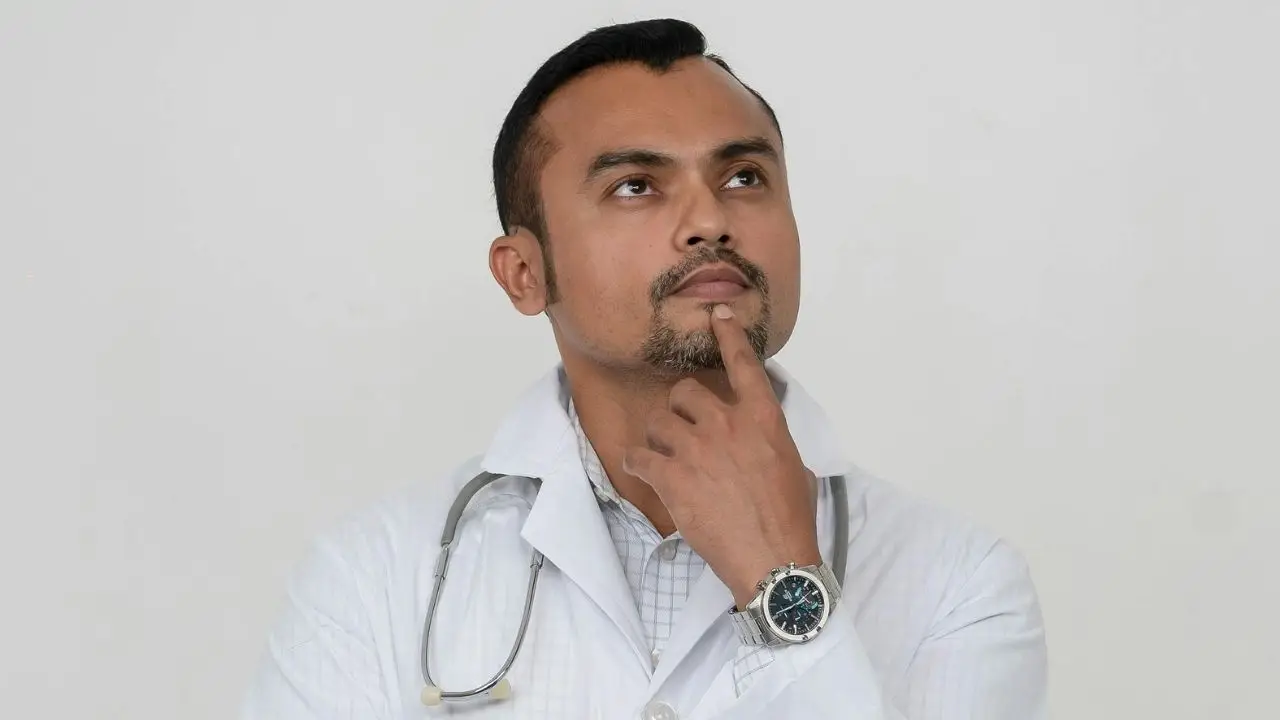 Concerned doctor considering next steps after malpractice insurance cancellation
