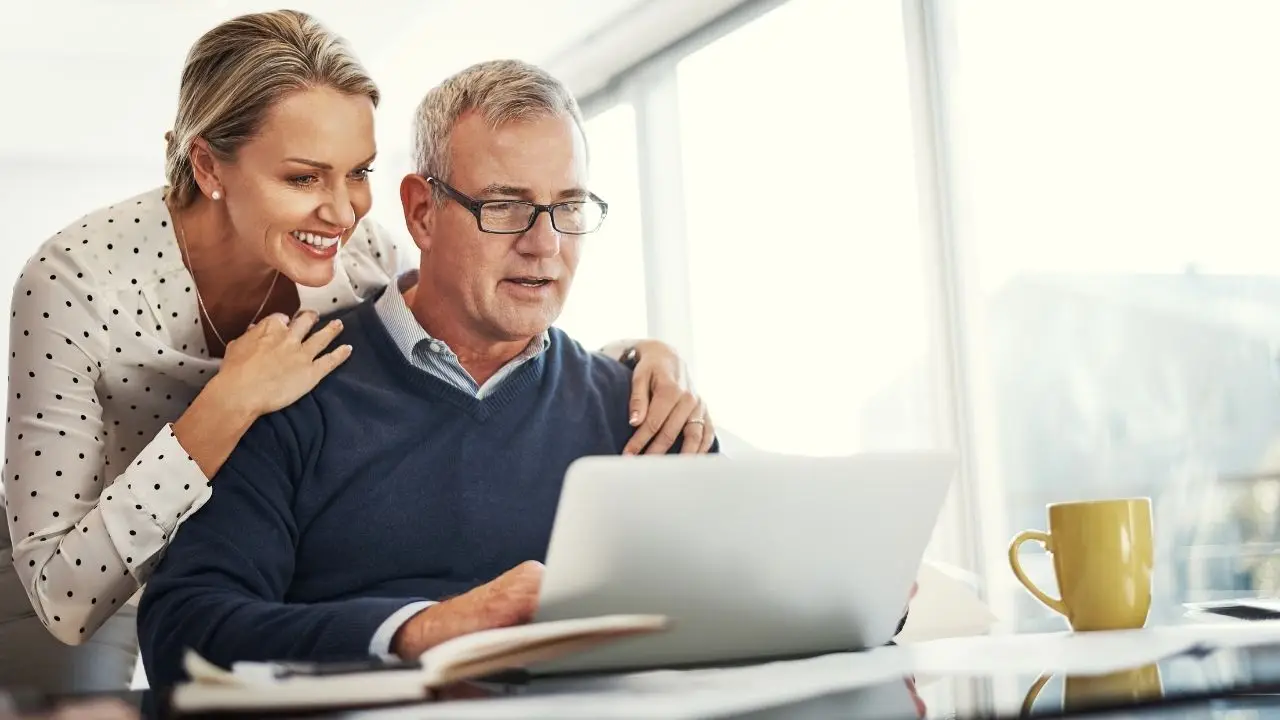 Retired physician reviewing tail coverage insurance with spouse